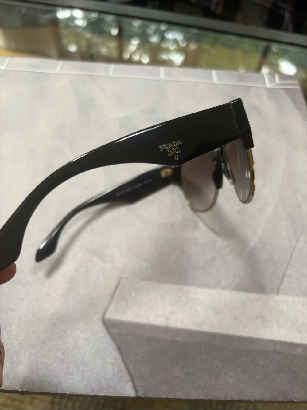 Prada Black Cat-Eye Sunglasses with Gold Trim
